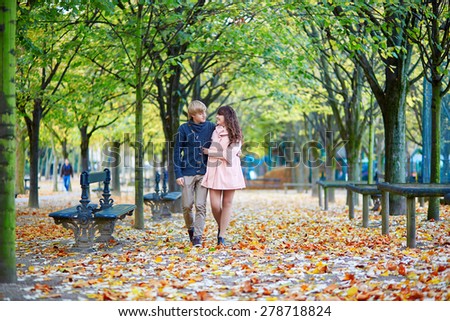 Young romantic couple in Paris, enjoying beautiful autumn day