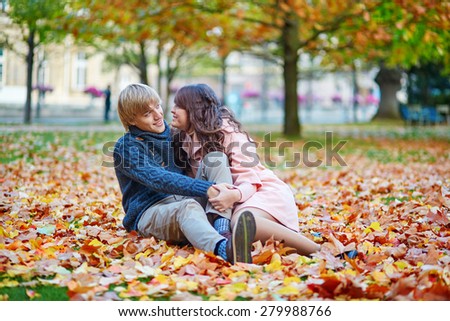 Young romantic loving couple in Paris, dating and enjoying nice autumn day together