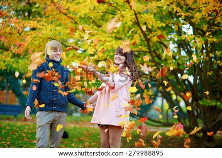 Young romantic loving couple in Paris, dating and enjoying nice autumn day together