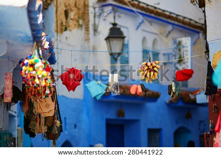 Spices and souvenirs on a street market in Chefchaouen, Morocco, small town in northwest Morocco known for its blue buildings