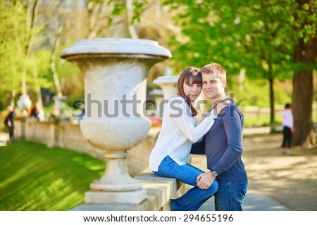 Young romantic couple in Paris, having a date in the Luxembourg garden