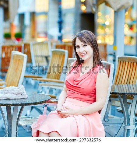 Beautiful young woman in an outdoor cafe in Vienna, Austria