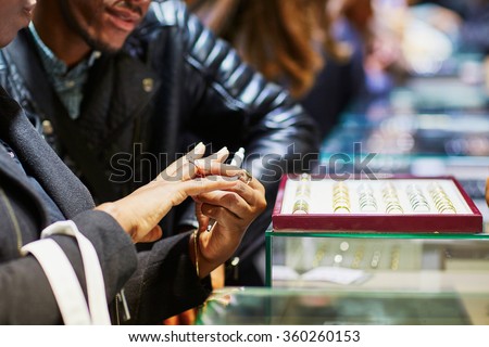 African American couple selecting a wedding ring