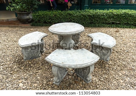 Stone Garden Table and four chairs.