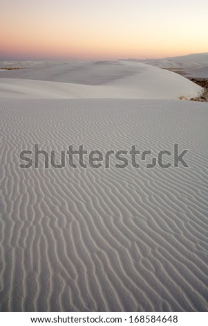 Dusk over gypsum sand dune shapes in White Sands National Monument, New Mexico