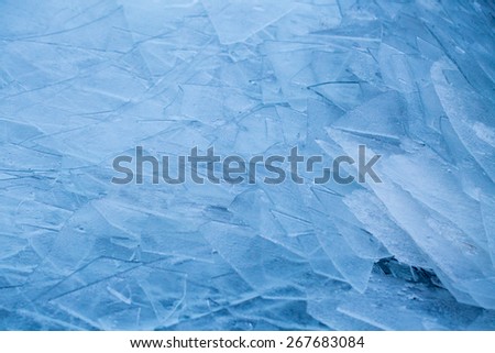 Ice washed up on lake shore like shards of glass, Lofoten, Norway