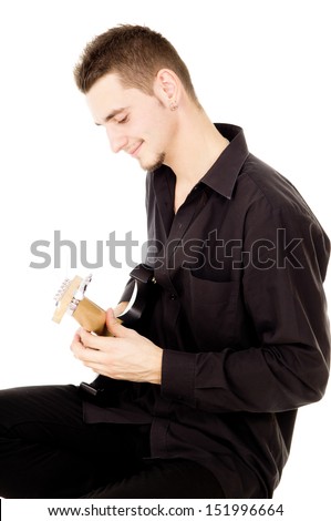 mischievous guy plays the electric guitar isolated on white background