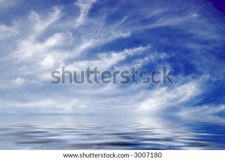 A digital composite of endless ocean reflecting feathery clouds in deep blue sky.