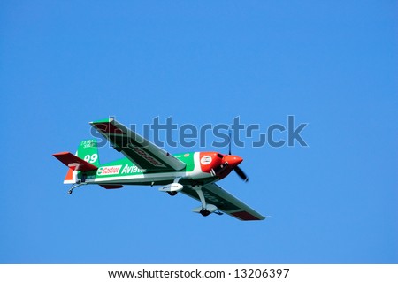 Red, white and green aerobatic plane at Red Bull Race at San Francisco Fleet Week.