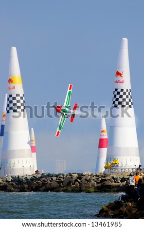 Airplane goes through an obstacle course at Red Bull air race during San Francisco Fleet week
