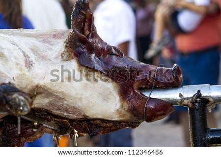 View of a roasted pig in the rack of a Medieval festival.