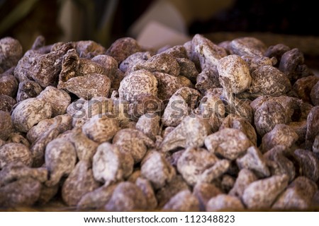 Close view of a bunch of dry figs on a table.