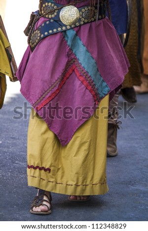 Close up view of a colorful long skirt of a gipsy.