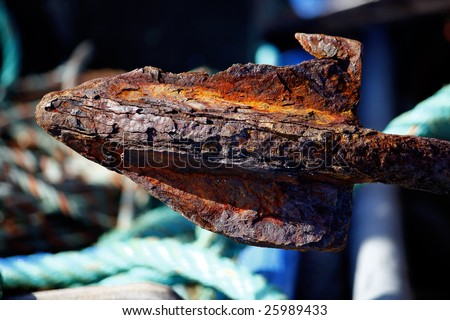 Closeup view of an old rusty detail of an anchor.