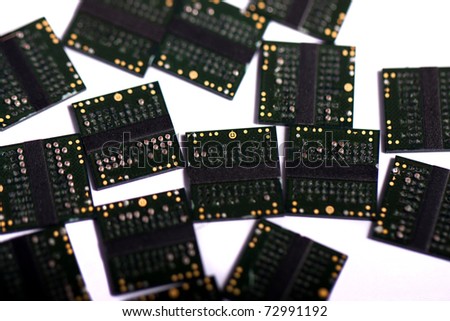 Close view of a bunch of computer memory chips isolated on a white background.