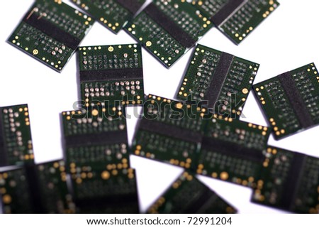 Close view of a bunch of computer memory chips isolated on a white background.
