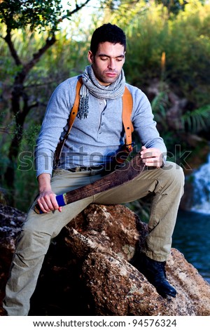 View of an treasure hunter, jungle adventurer type man.