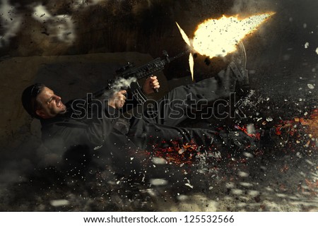 View of a contracted type killer agent thrown in middle air from an explosion firing a machine gun.
