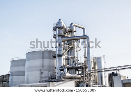 View of an industrial oil refinery with shiny tubes.