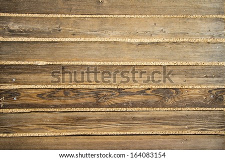 Close up view of a background of a wood board walk in the beach.