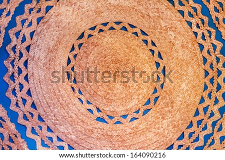 Close up view of a traditional handmade wicker dish base .