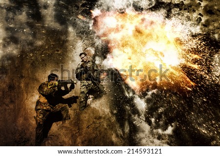 Two airsoft group team members crouch in defense of a massive resulting explosion.