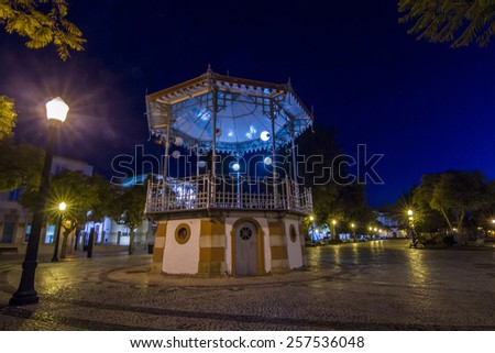 Night view of the park area next to the marina of Faro city, Portugal.