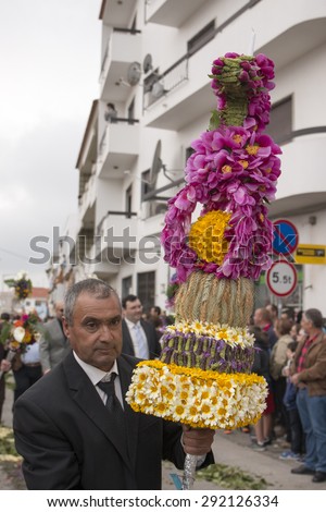 SAO BRAS DE ALPORTEL, PORTUGAL - April, 2015: Traditional religious procession of the flower torches event located in village of Sao Bras de Alportel, Portugal.