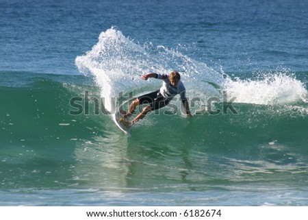 A surfer turns on a nice right hand wave.