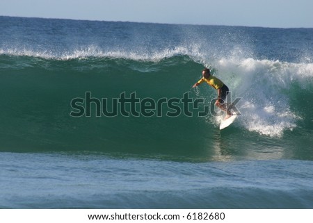 A surfer on a nice clean right hand wave