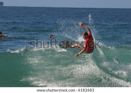 A surfer turns off the top