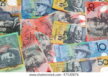 Various Australian banknotes spread randomly