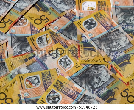 Closeup of many Australian 50 dollar notes.