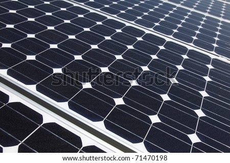 Closeup of solar panel cells mounted on roof top. Solar energy is becoming an important part of the energy mix.