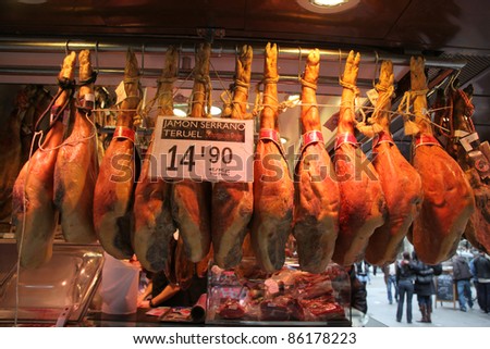 BARCELONA - MARCH 30:A butcher shop in the world famous, La Boqueria in Barcelona, Spain on March 30, 2009. Spain is renowned for cured and prepared meats such as Jamon as shown in this picture.