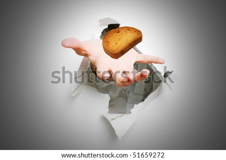 The stretched hand and dry piece of bread.