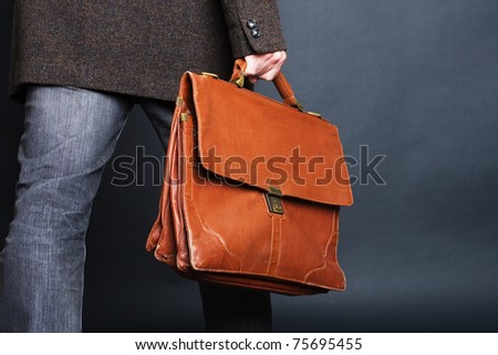 person holding suitcase