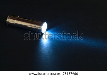 Blue torch light in the dark.