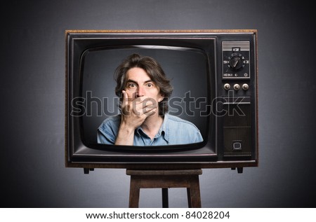 Scared man in old TV screen.