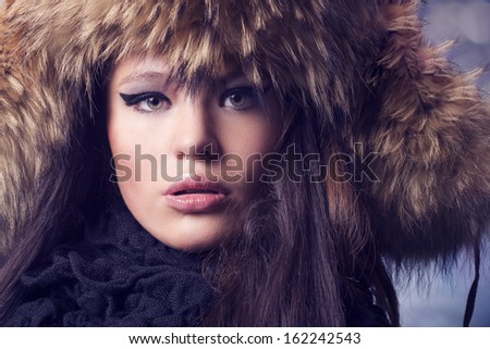 portrait of a beautiful lady in fur cap
