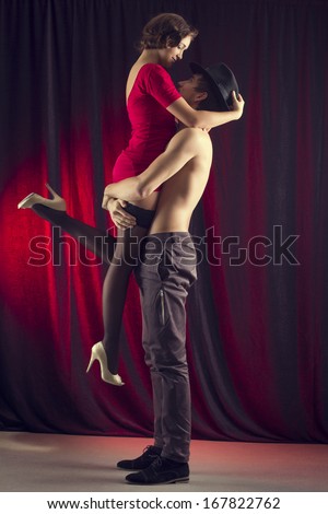 man and a woman in the most romantic dance: tango.
