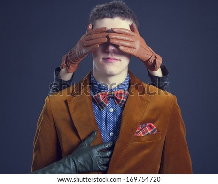 Female hand turning a blind eye stylish men