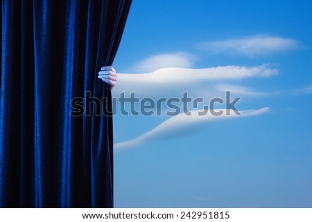 Man\'s hand opens the curtain.
