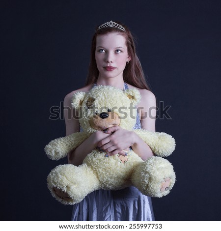 portrait of a girl with a teddy bear