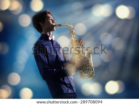 A man plays the saxophone