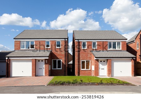 New english detached houses with garage