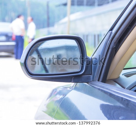 the view of the rear-view mirror, people talking