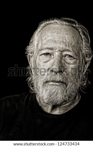 Toned black and white image of serious tough old man