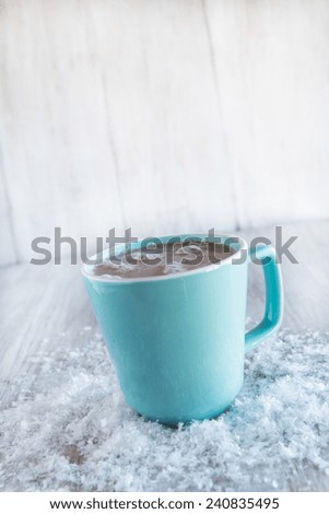Cozy winter hot chocolate drink with snow