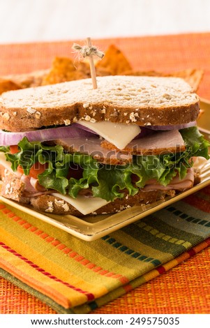 Hearty lunch sandwich food of turkey and ham on wheat bread